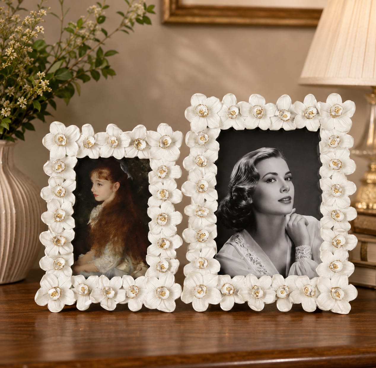 White flower frames with gold accents on a tabletop display